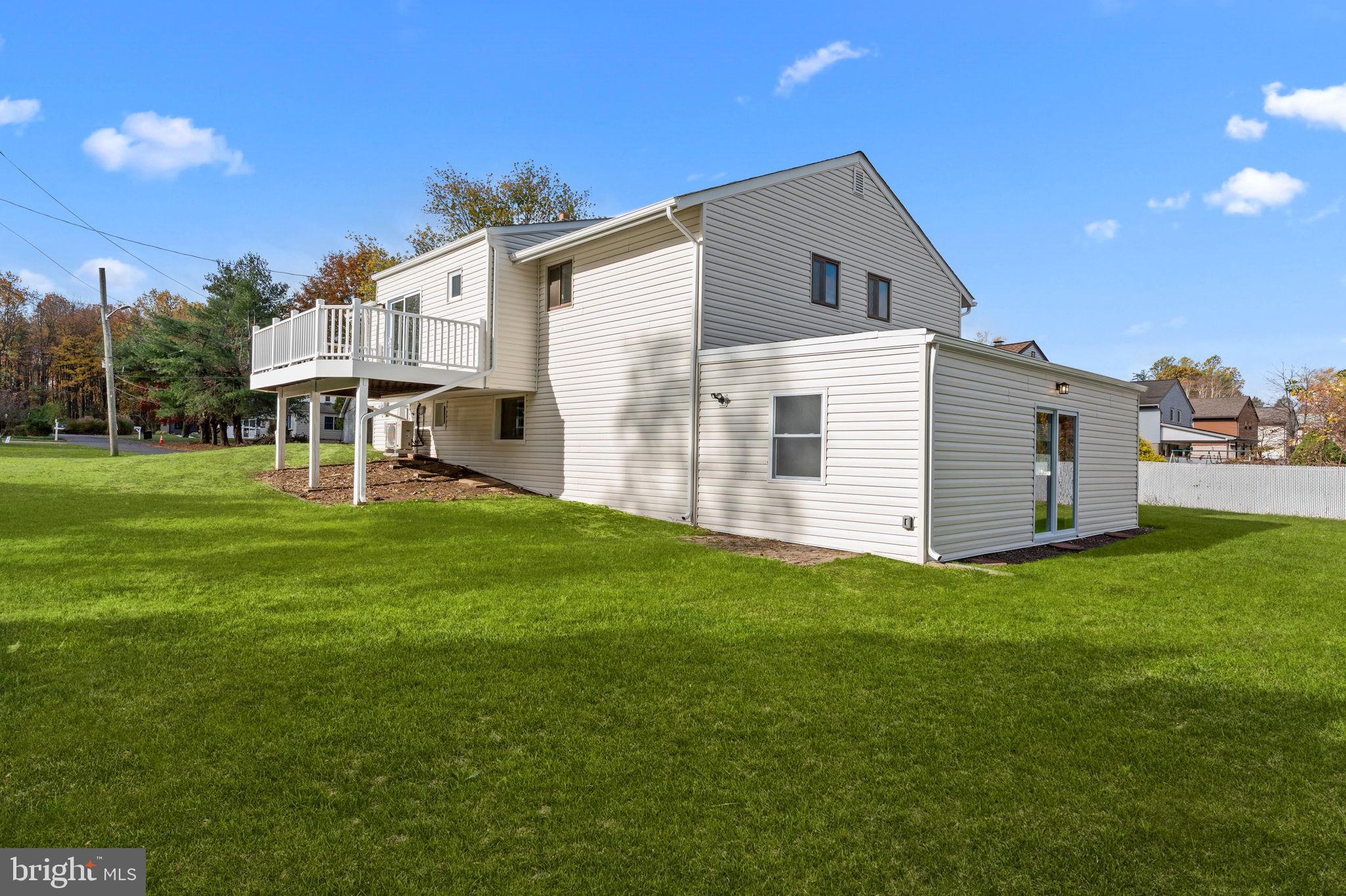 100 East Endfield Road Feasterville-Trevose, PA 19053 - Photo 52 of 53 a front view of a house with a yard and garage