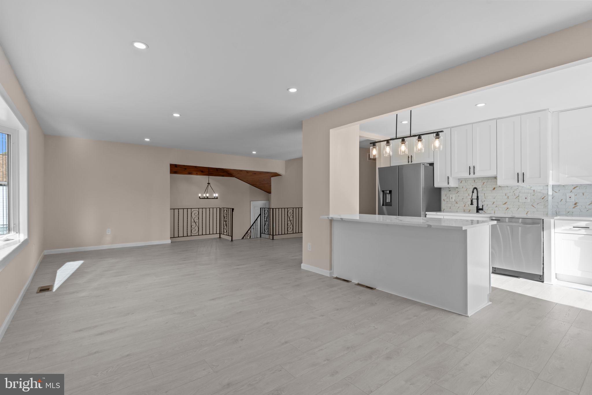 100 East Endfield Road Feasterville-Trevose, PA 19053 - Photo 7 of 53 a view of a kitchen with a sink and dishwasher a refrigerator with white cabinets
