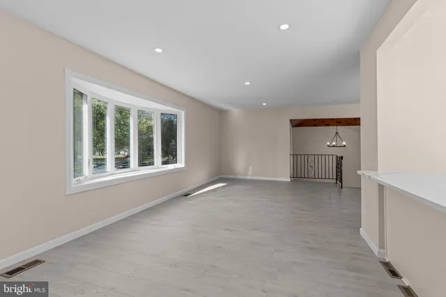 a view of an empty room with a window