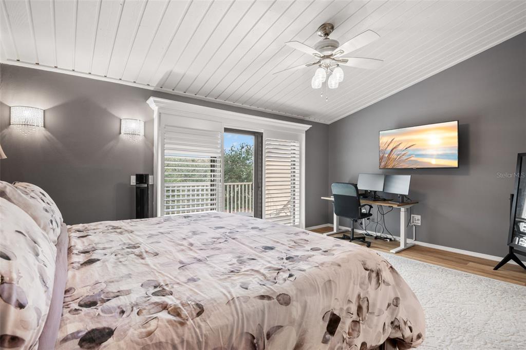529 Sandy Hook Road Treasure Island, FL 33706 - Photo 26 of 55 a bedroom with a bed and a chandelier