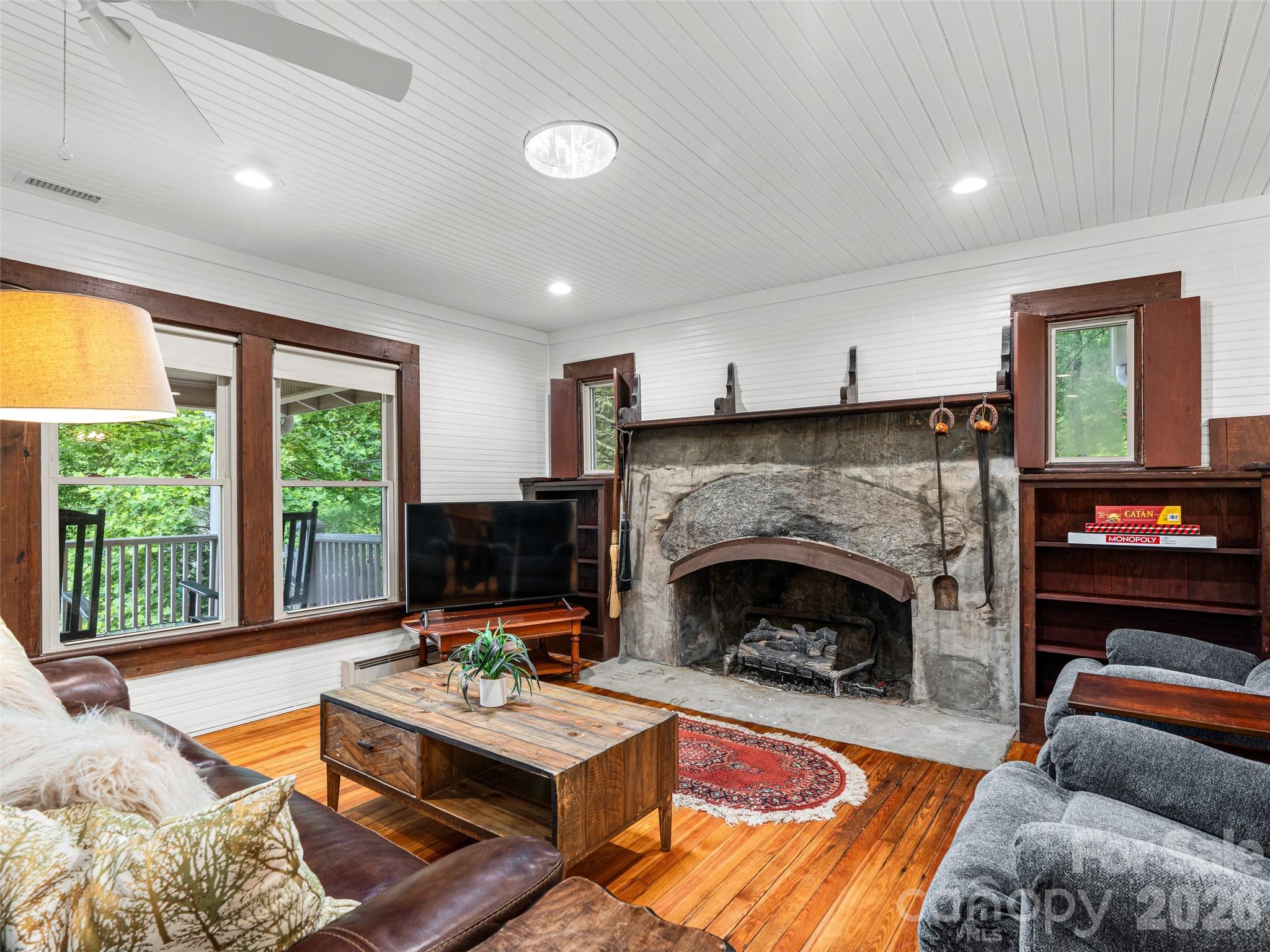 206 Chestnut Hill Road Gerton, NC 28735 - Photo 15 of 48 a living room with furniture and a fireplace