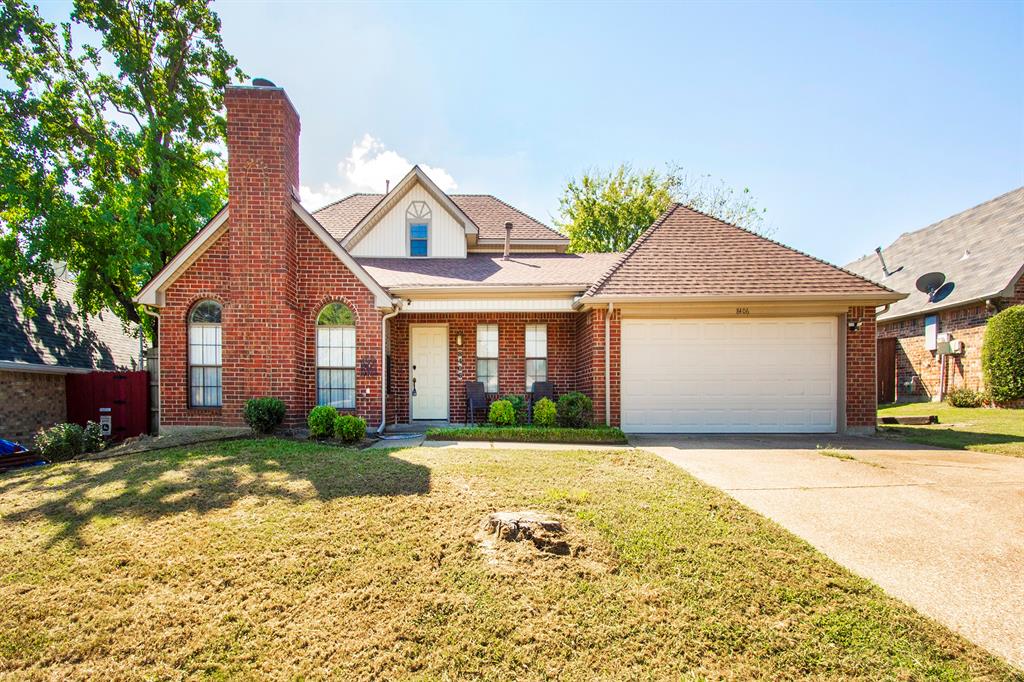 8406 Americas Cup Rowlett, TX 75089 - Photo 1 of 1 View of front of house featuring a porch, concrete driveway, roof with shingles, a chimney, and brick siding