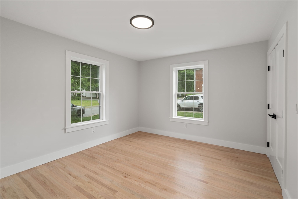 19 Whitehorse Road Hingham, MA 02043 - Photo 18 of 35 an empty room with wooden floor and windows