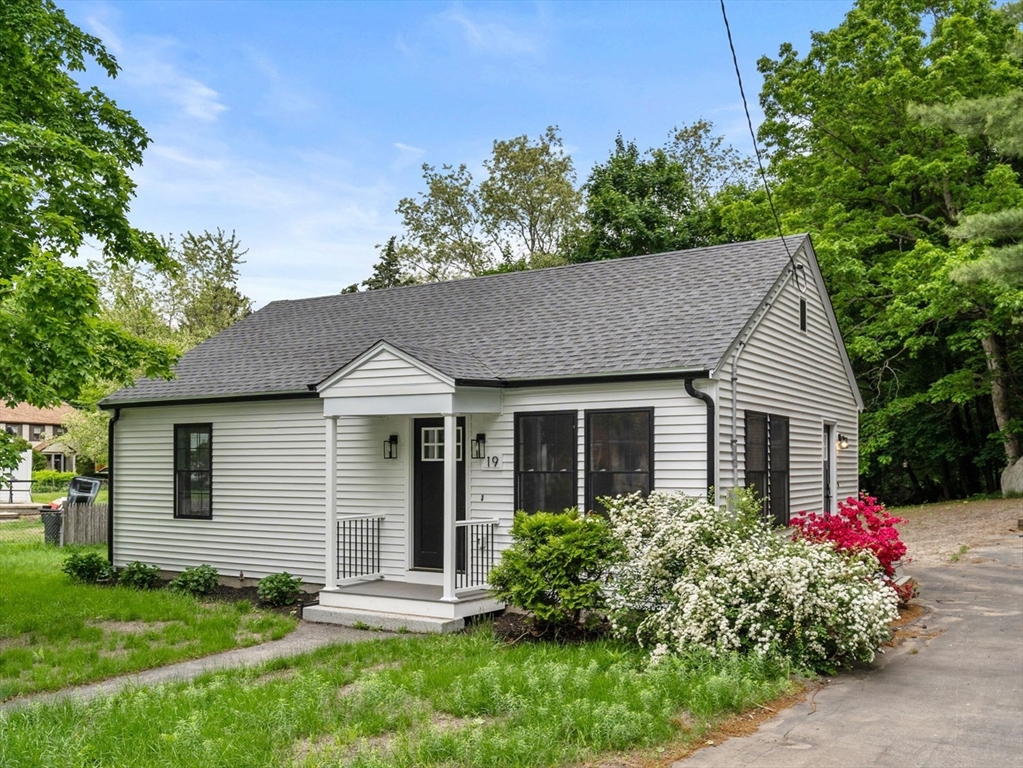 19 Whitehorse Road Hingham, MA 02043 - Photo 2 of 35 a front view of a house with a yard and garage