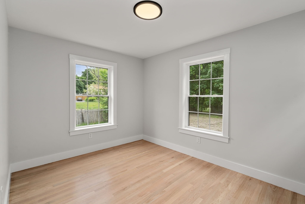 19 Whitehorse Road Hingham, MA 02043 - Photo 22 of 35 an empty room with wooden floor and windows