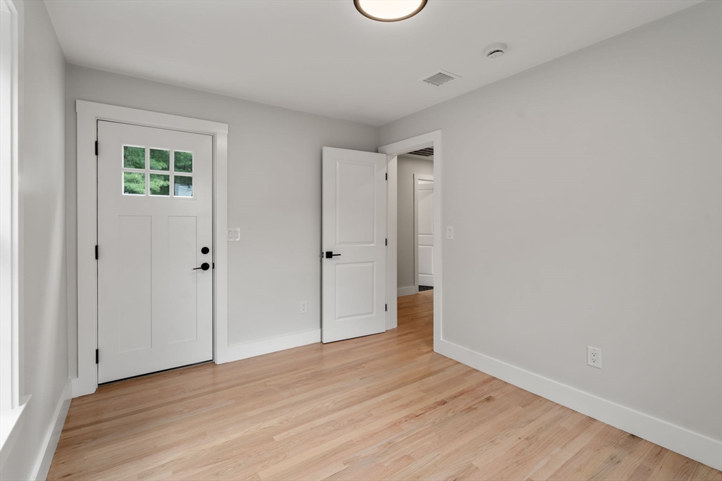 19 Whitehorse Road Hingham, MA 02043 - Photo 23 of 35 a view of an empty room with wooden floor
