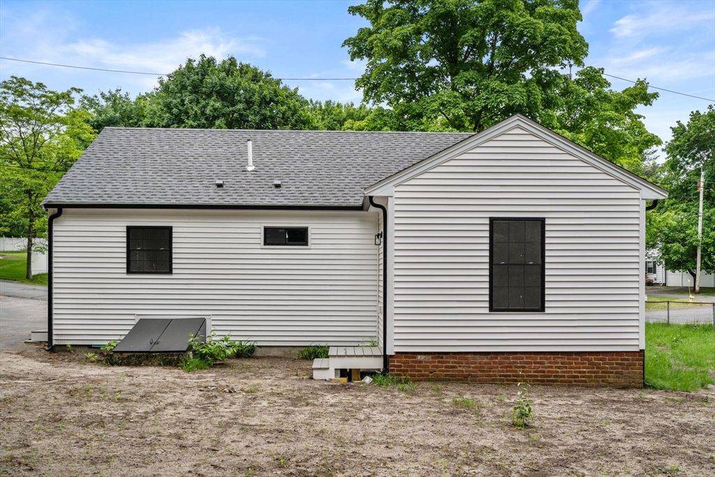 19 Whitehorse Road Hingham, MA 02043 - Photo 29 of 35 a view of a white house with a small yard and a large window
