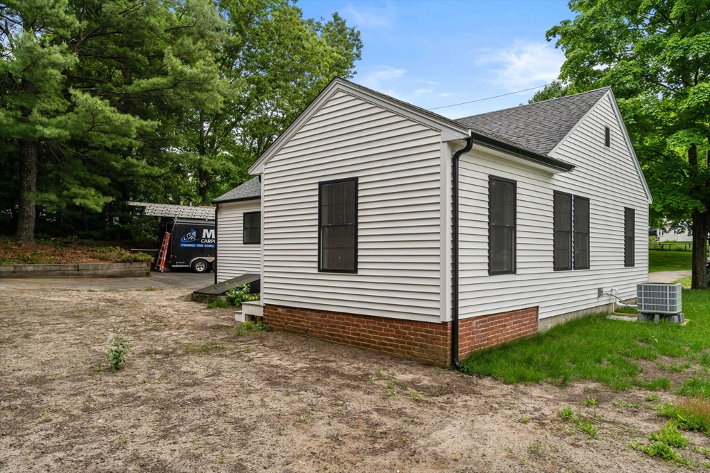 19 Whitehorse Road Hingham, MA 02043 - Photo 30 of 35 a view of house with backyard and a garden
