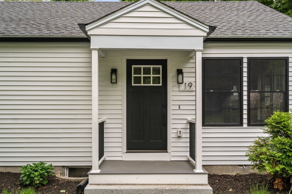 19 Whitehorse Road Hingham, MA 02043 - Photo 3 of 35 a front view of a house with a garden