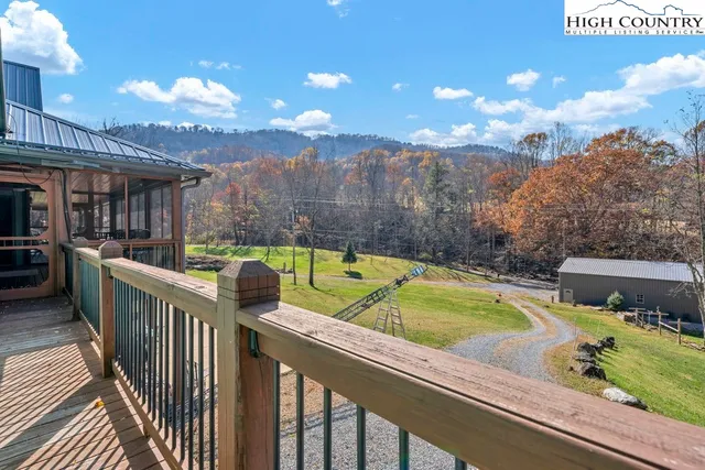 a view of a chairs and table in the balcony