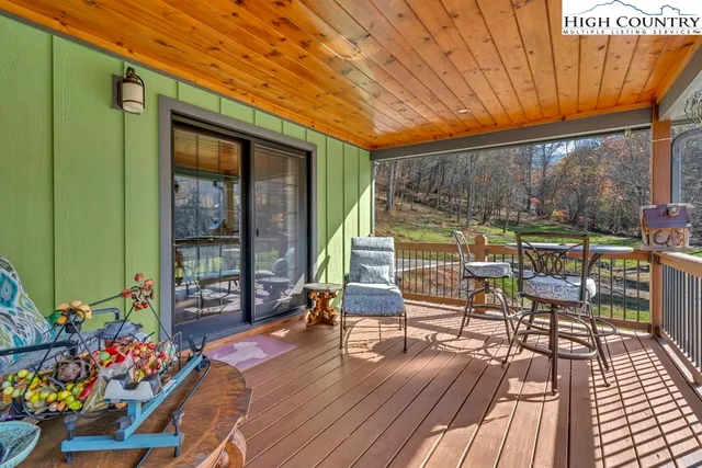a view of balcony with couch and wooden floor