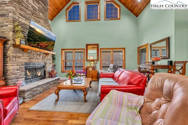 a view of a livingroom with furniture window and a fireplace