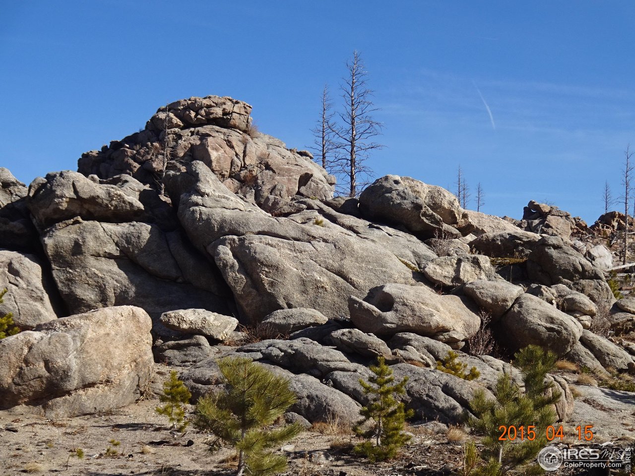 2315 Ridge Road Nederland, CO 80466 - Photo 23 of 28 a bed with white sheets and pillows on it