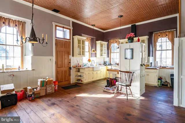a view of a livingroom with furniture and a flat screen tv