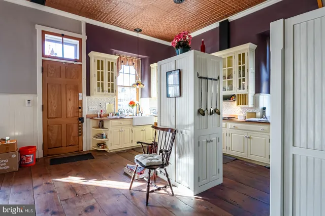 a kitchen with a sink and cabinets