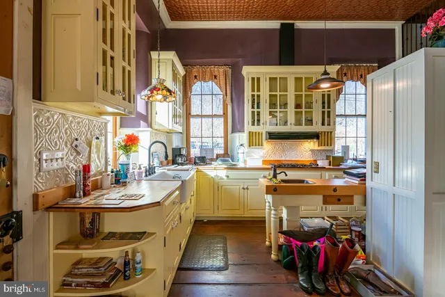 a kitchen with stainless steel appliances granite countertop a stove and a sink