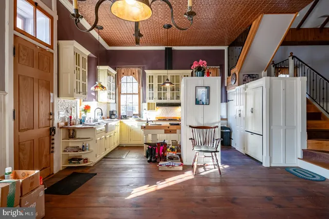 a kitchen with a stove and a refrigerator