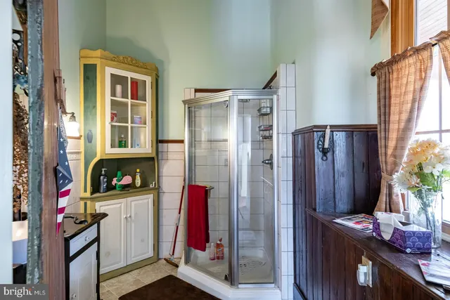 a kitchen with a refrigerator and a window