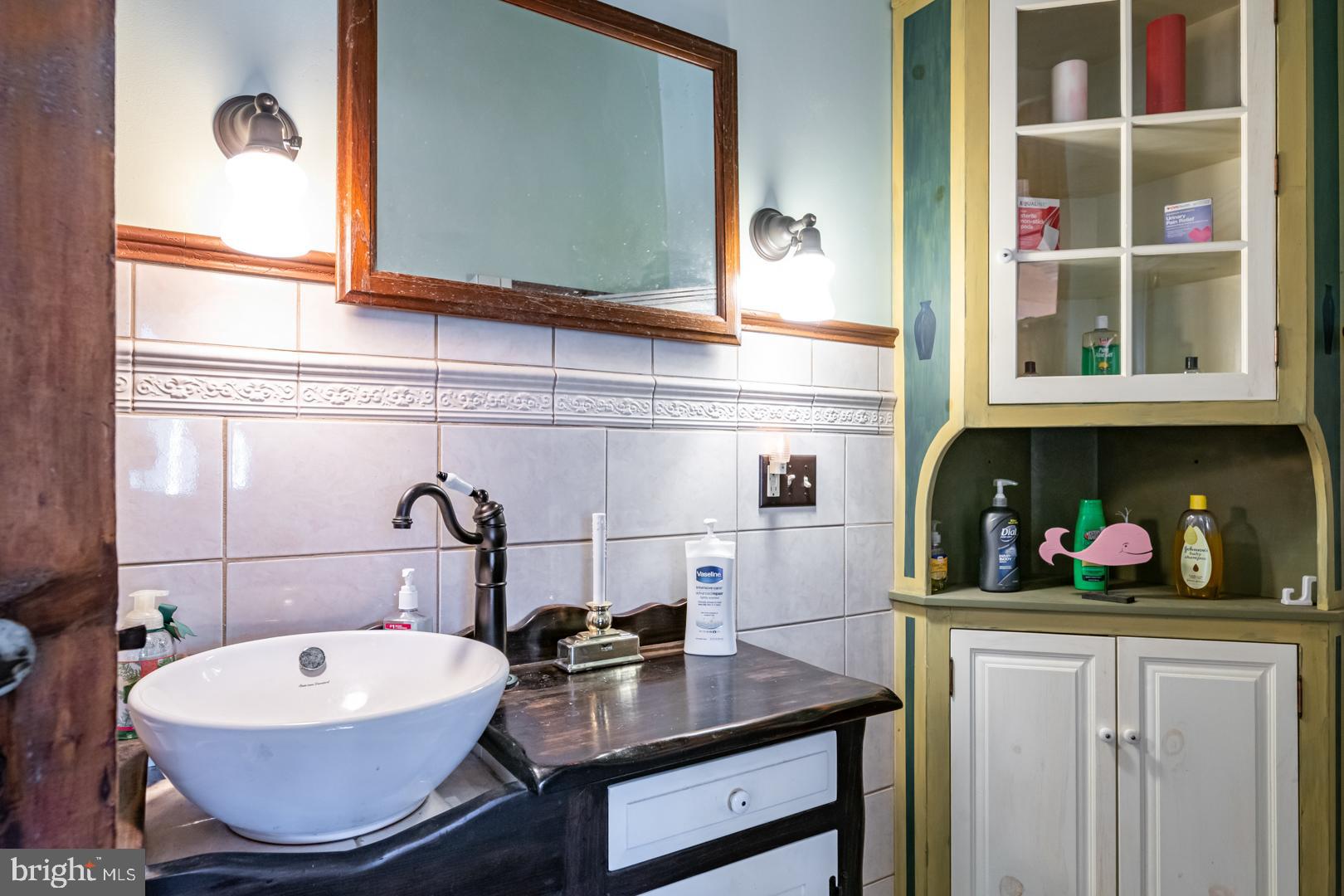 1192 Fritztown Road Reinholds, PA 17569 - Photo 24 of 36 a bathroom with a toilet a sink and a window