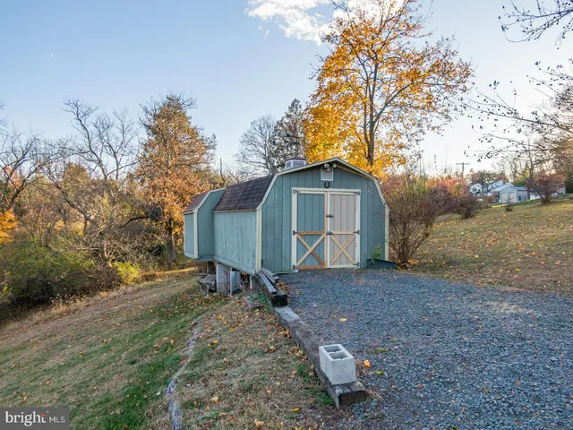 a view of sitting area with wooden fence