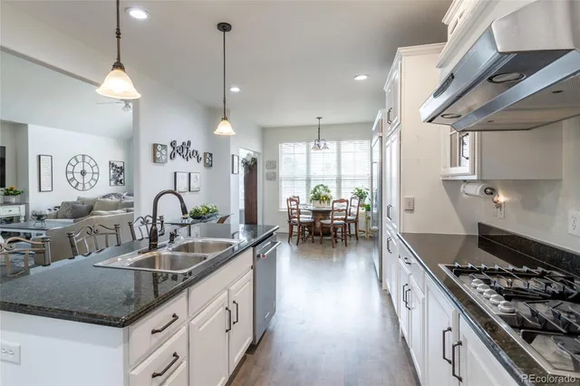 a kitchen with stove and cabinets