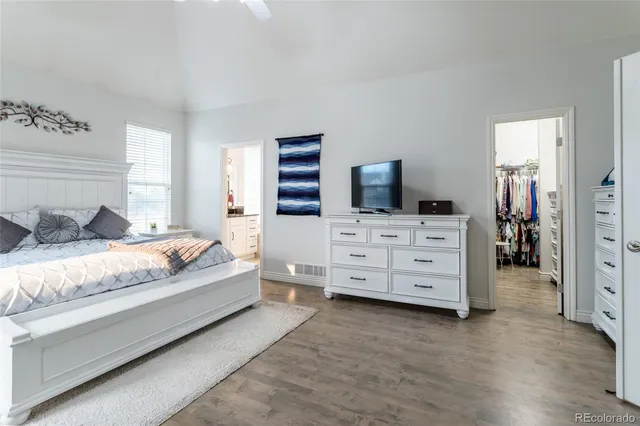 a bedroom with a bed and dresser