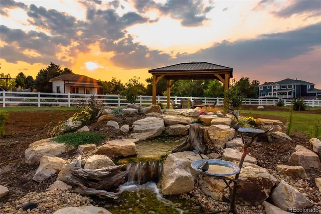 a view of a lake with sitting area