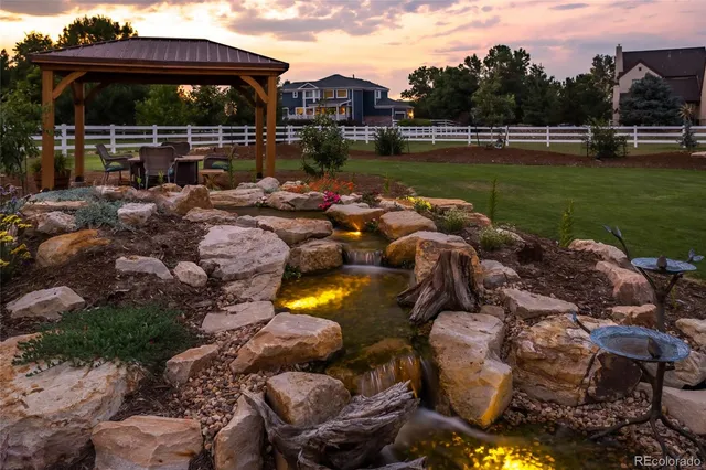 a view of a house with a yard porch and sitting area