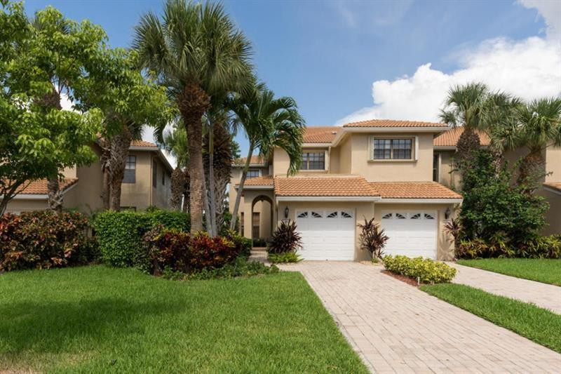 6761 Montego Bay Boulevard, Unit B Boca Raton, FL 33433 - Photo 1 of 34 a front view of a house with a garden and a tree