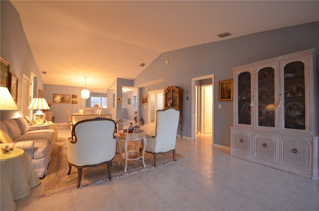 6761 Montego Bay Boulevard, Unit B Boca Raton, FL 33433 - Photo 2 of 34 a view of a livingroom with furniture and a chair
