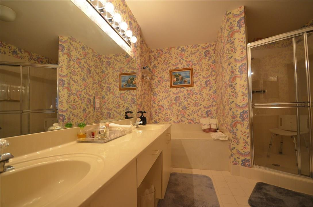 6761 Montego Bay Boulevard, Unit B Boca Raton, FL 33433 - Photo 24 of 34 a bathroom with a tub sink and shower