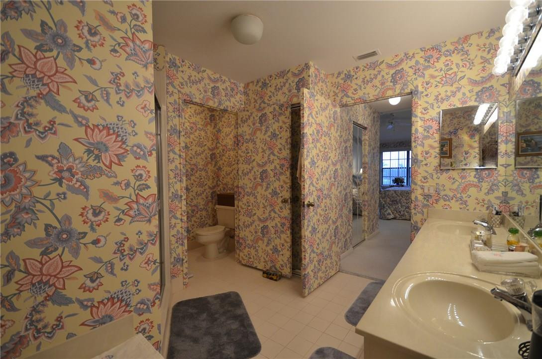 6761 Montego Bay Boulevard, Unit B Boca Raton, FL 33433 - Photo 25 of 34 a bathroom with a sink toilet and shower