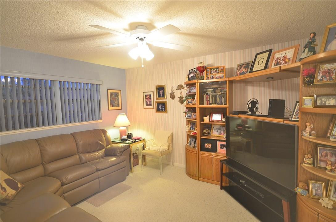 6761 Montego Bay Boulevard, Unit B Boca Raton, FL 33433 - Photo 7 of 34 a living room with furniture cabinets and window