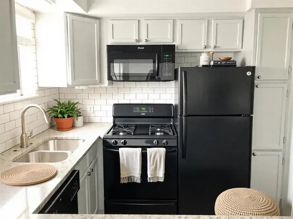 a kitchen with a sink stove and refrigerator