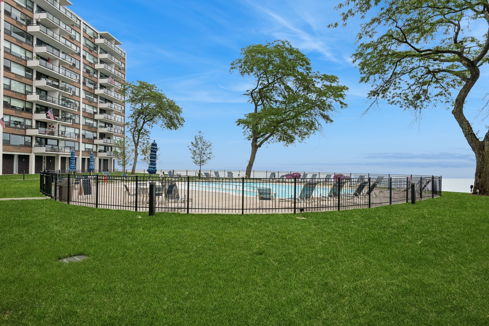 1630 Sheridan Road, Unit 8K Wilmette, IL 60091 - Photo 32 of 40 a view of a lake with a garden and trees