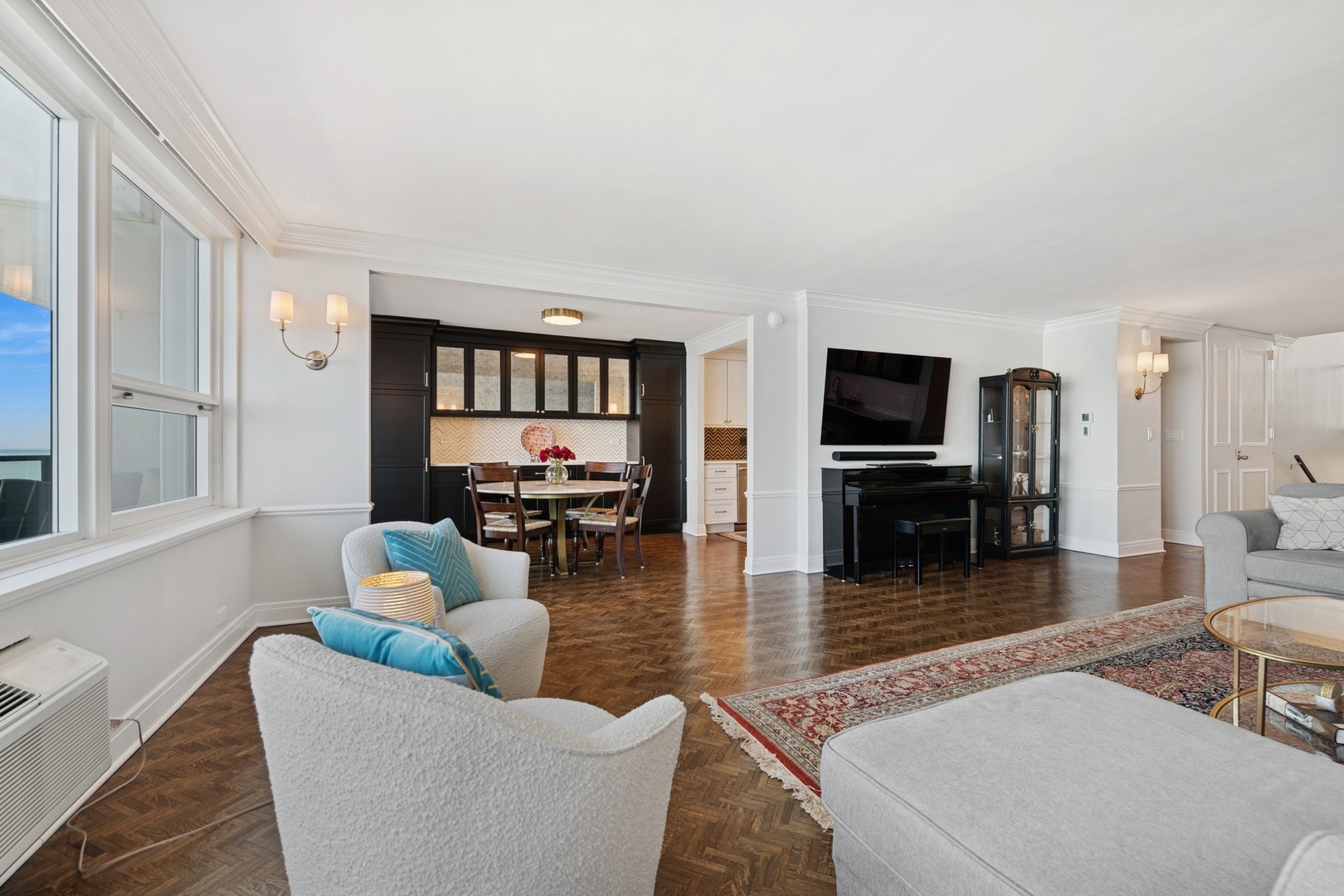 1630 Sheridan Road, Unit 8K Wilmette, IL 60091 - Photo 9 of 40 a living room with fireplace furniture and a flat screen tv