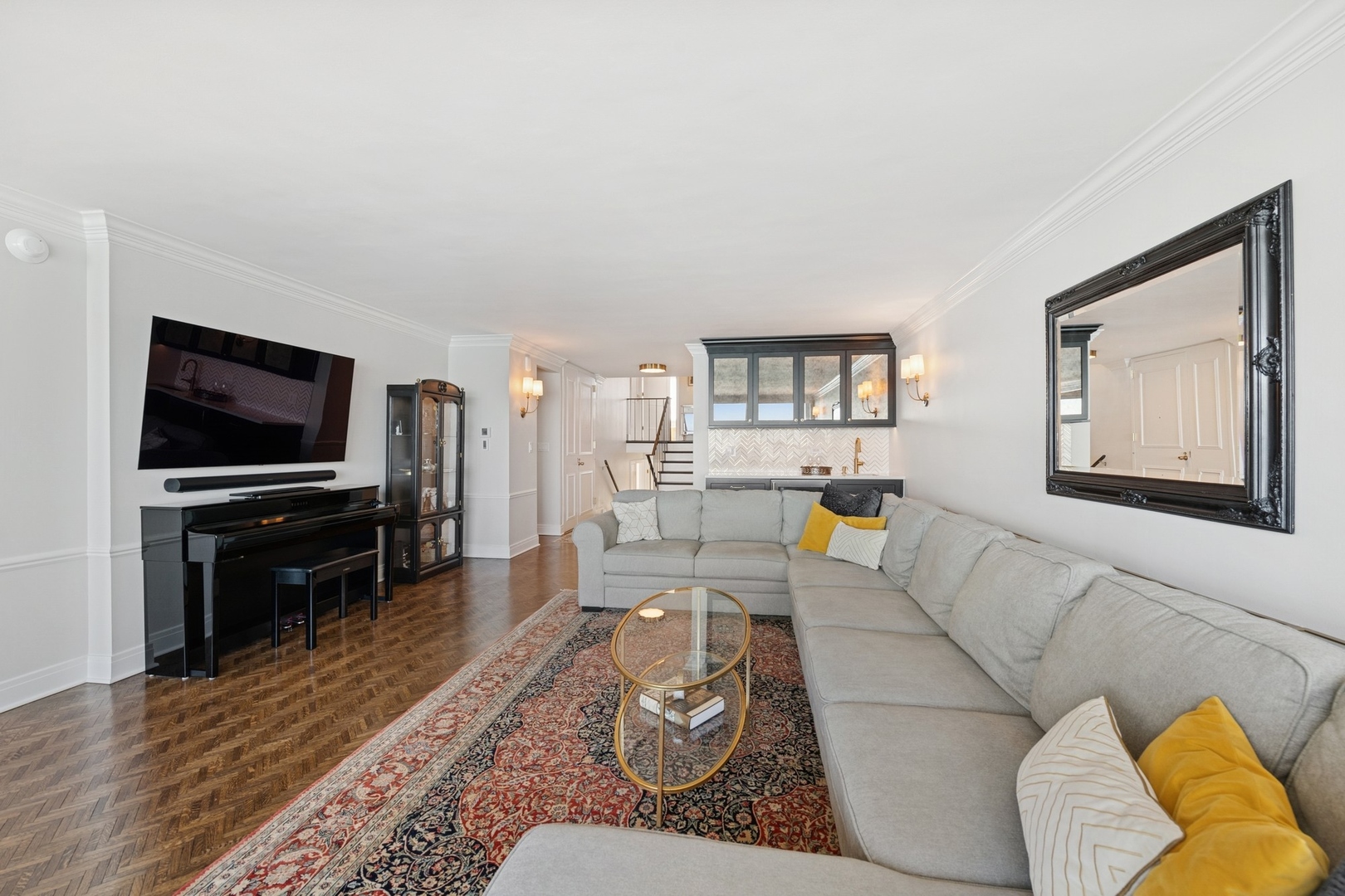 1630 Sheridan Road, Unit 8K Wilmette, IL 60091 - Photo 10 of 40 a living room with furniture and a flat screen tv