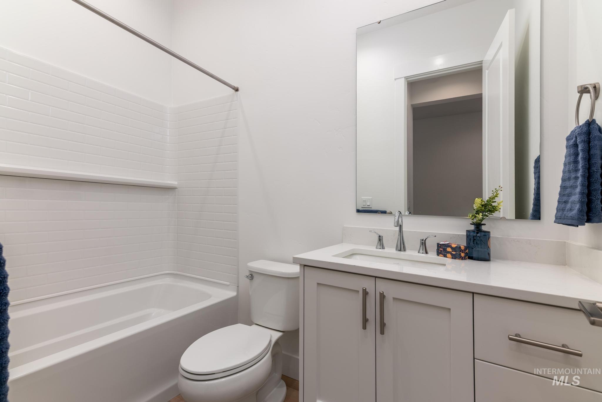 9074 West Moonglade Street Star, ID 83669 - Photo 24 of 40 Bathroom featuring a white subway tile shower surround over a tub