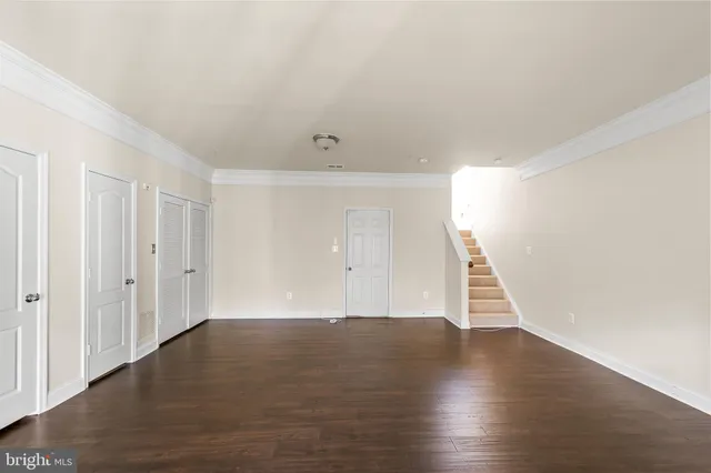 a picture of a bench in front of a wall