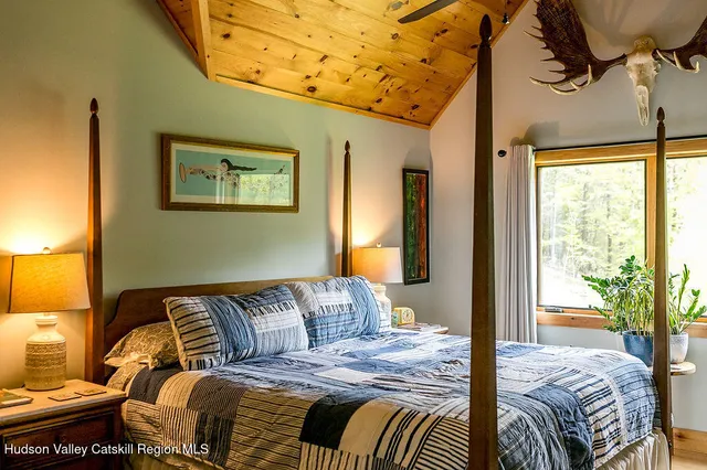 a bedroom with a bed and a couch