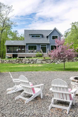 a view of a lush green field with lots of bushes