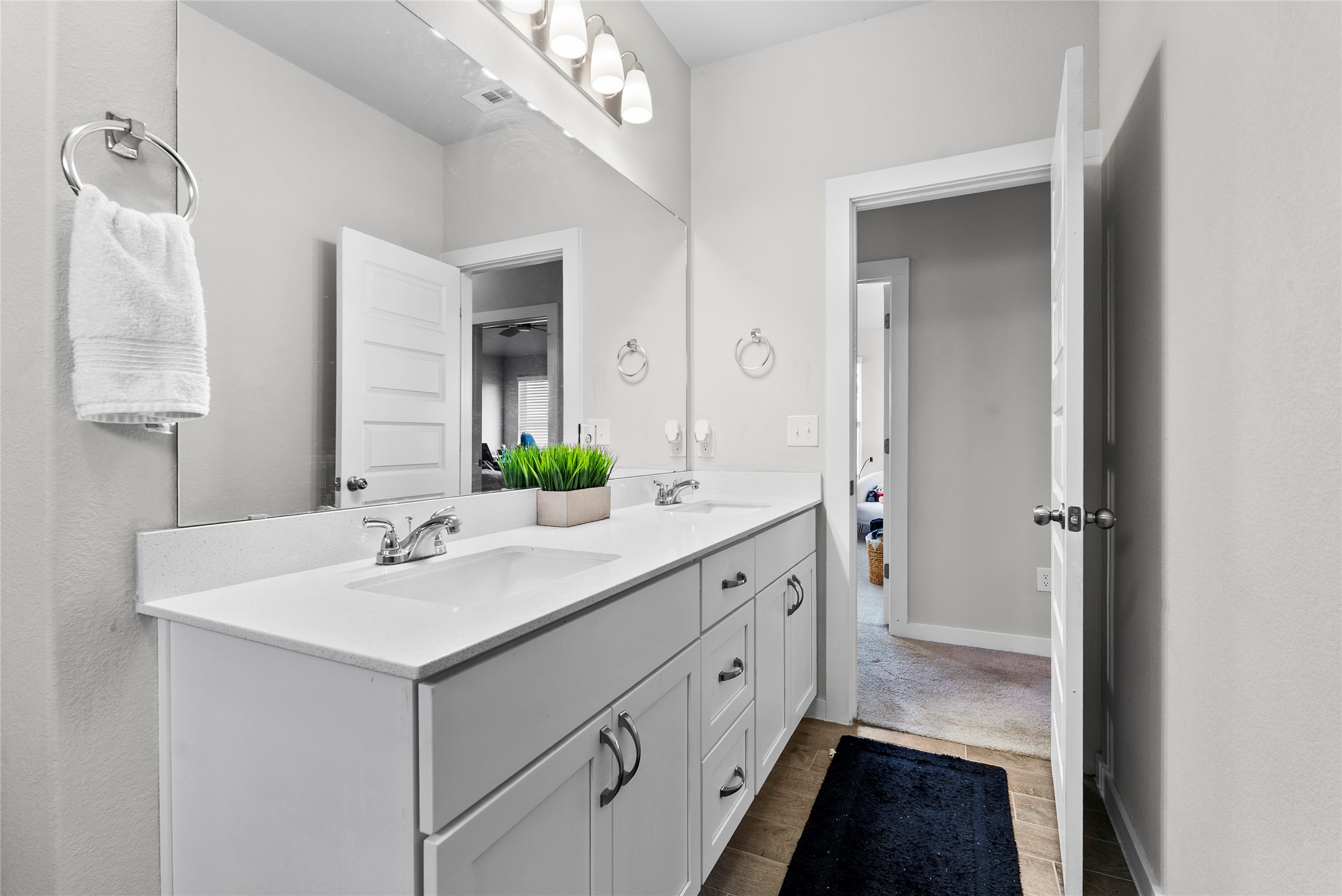 156 Appleberry Lane Elgin, TX 78621 - Photo 23 of 40 a bathroom with a sink double vanity and a mirror
