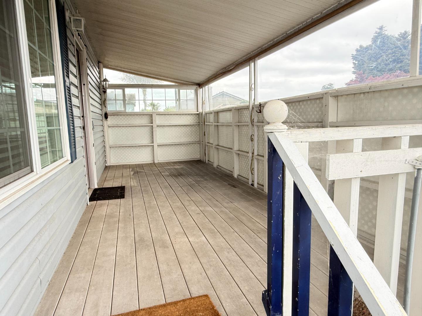 2155 Wharf Road, Unit 12 Capitola, CA 95010 - Photo 7 of 20 a view of a balcony with wooden floor and staircase