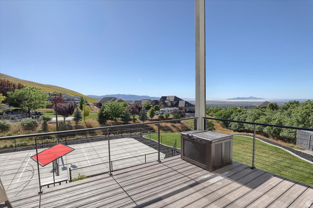 828 South Deer Road Tooele, UT 84074 - Photo 46 of 51 Expansive exterior deck featuring wood-finish flooring and a cable railing system
