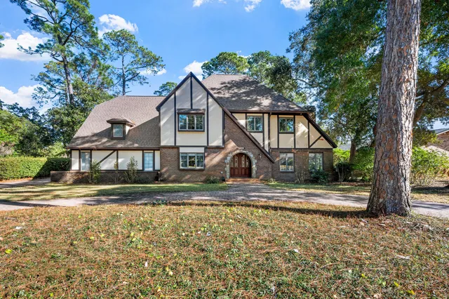 a living room with a stove and a refrigerator