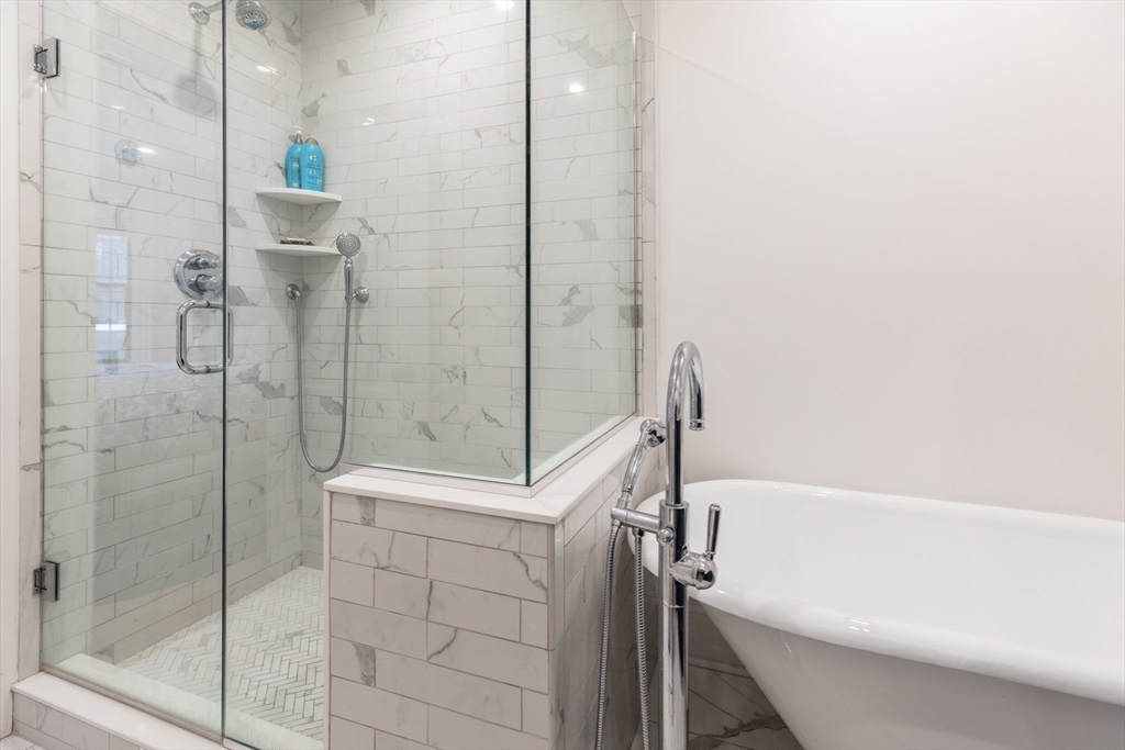 23 Braddock Park, Unit 2 Boston, MA 02116 - Photo 15 of 22 a bathroom with a bathtub and a shower