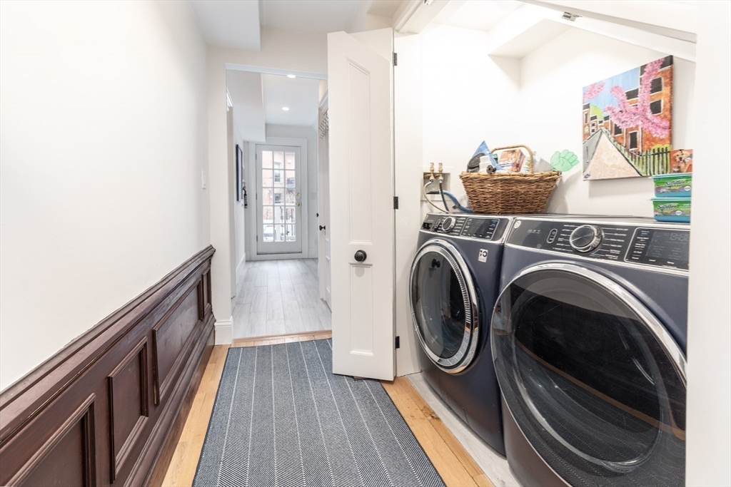 23 Braddock Park, Unit 2 Boston, MA 02116 - Photo 17 of 22 a view of a hallway with washer and dryer