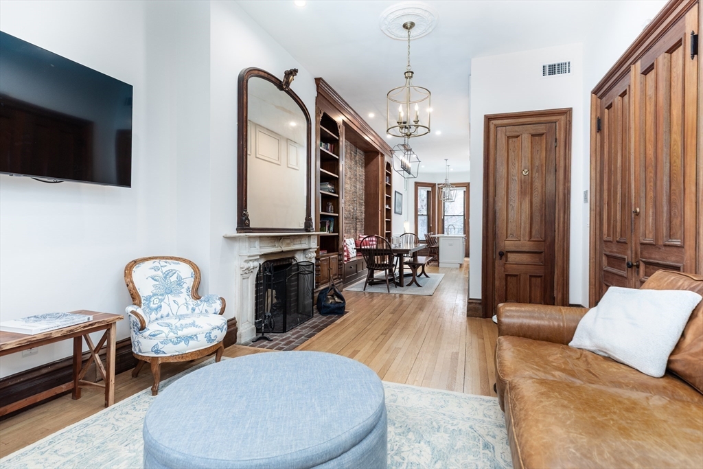 23 Braddock Park, Unit 2 Boston, MA 02116 - Photo 4 of 22 a living room with fireplace furniture and a flat screen tv