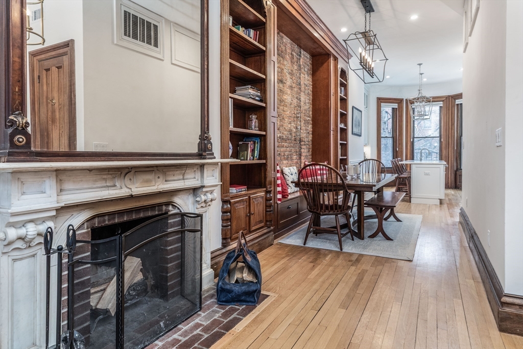 23 Braddock Park, Unit 2 Boston, MA 02116 - Photo 5 of 22 a view of a dining room with furniture and wooden floor