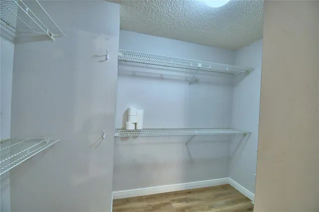 a view of a livingroom with a fireplace and window